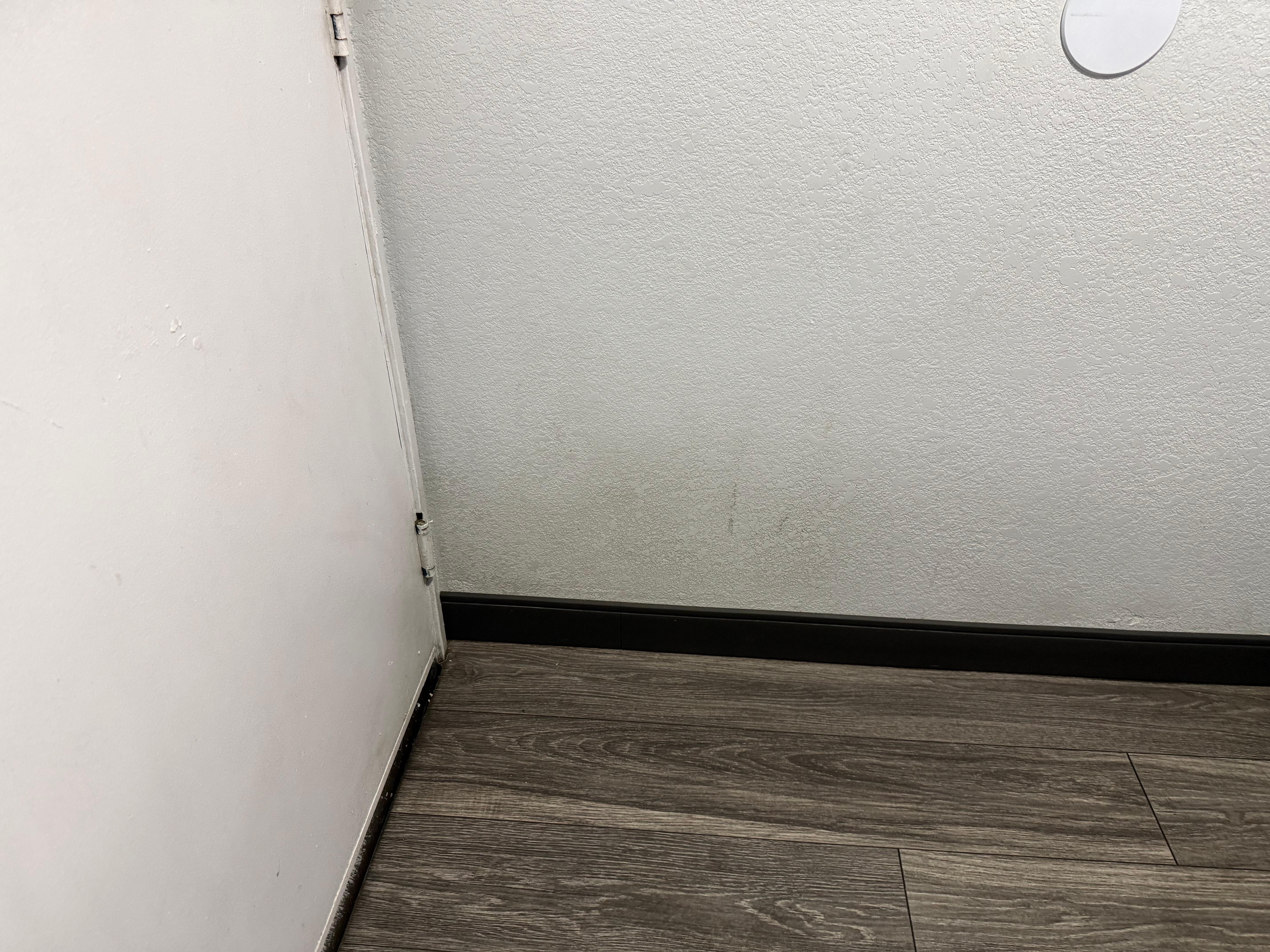 Dirty wall behind the door 