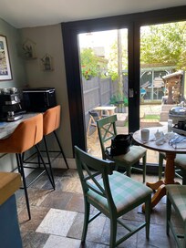 Dining area with bi-fold doors to garden