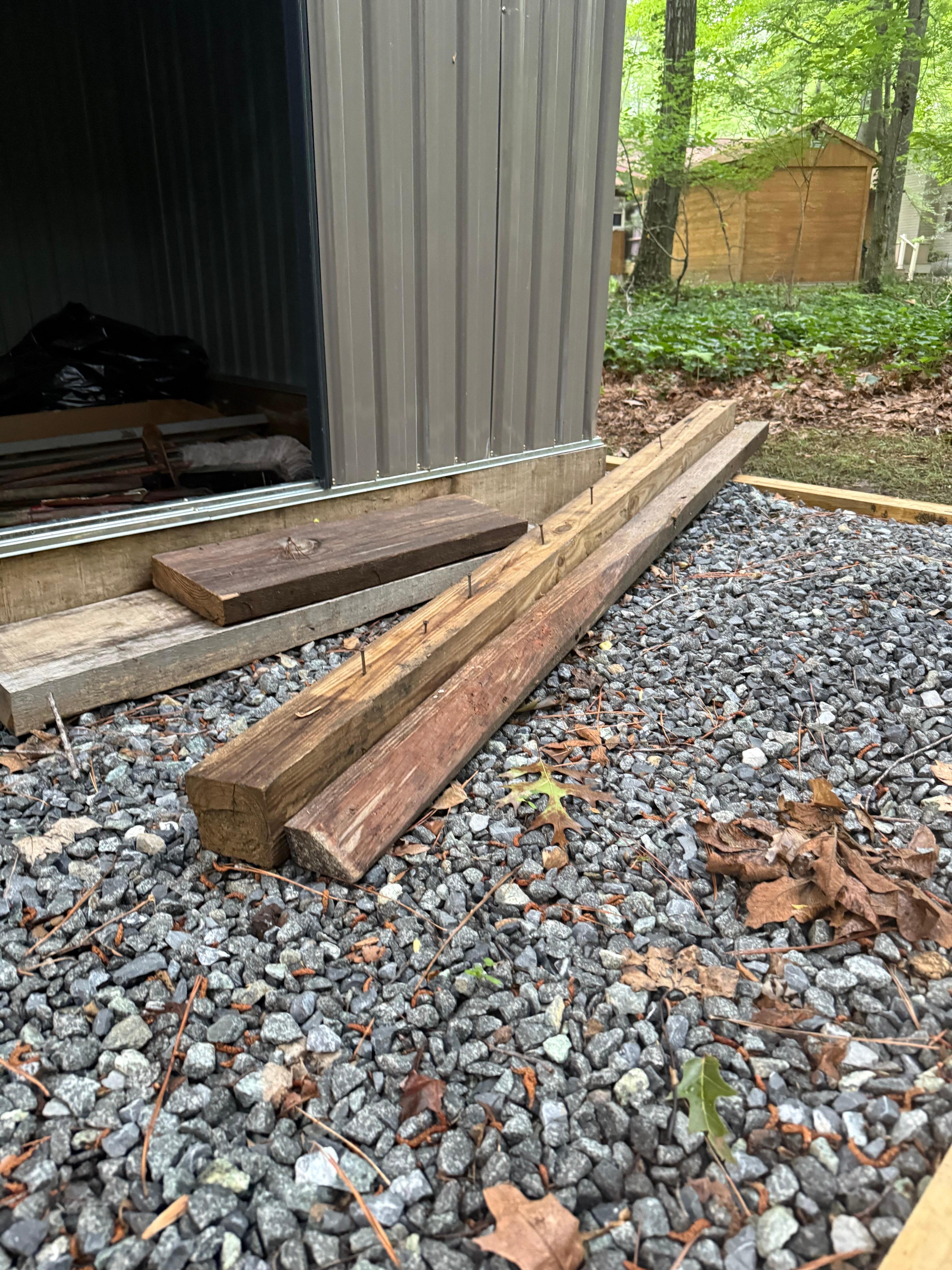 Wood with large screws sticking out