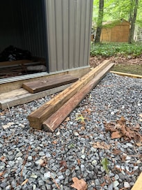 Wood with large screws sticking out