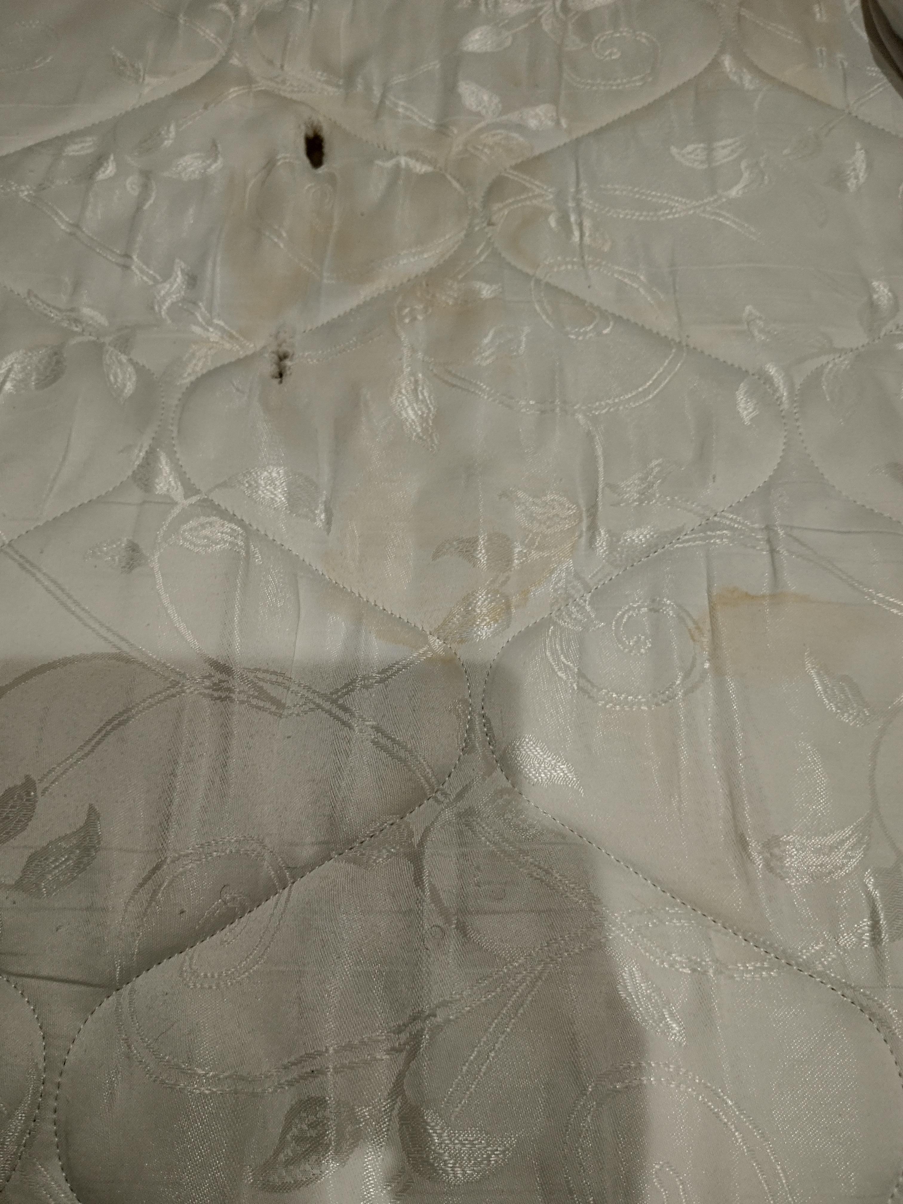 Mattress urine stains and holes