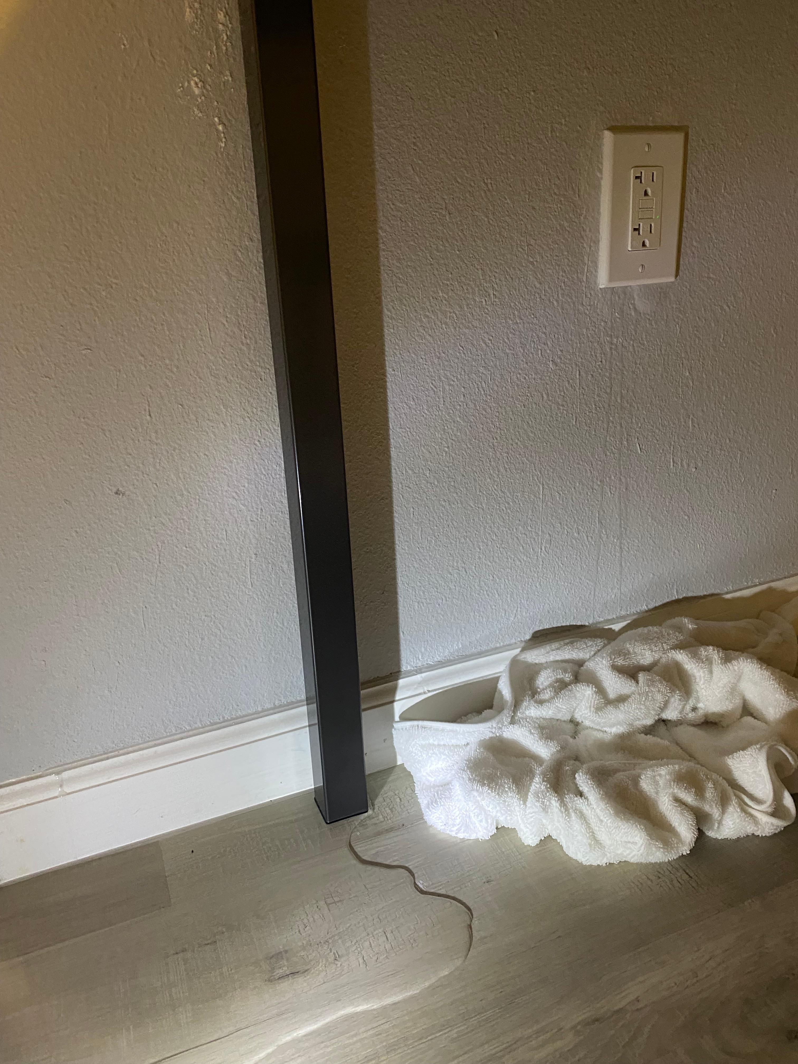Water dribbling out of electrical outlet onto the floor in middle of the night! Bad safety hazard & liability