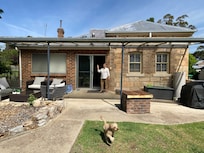 Rusty enjoying the big back yard