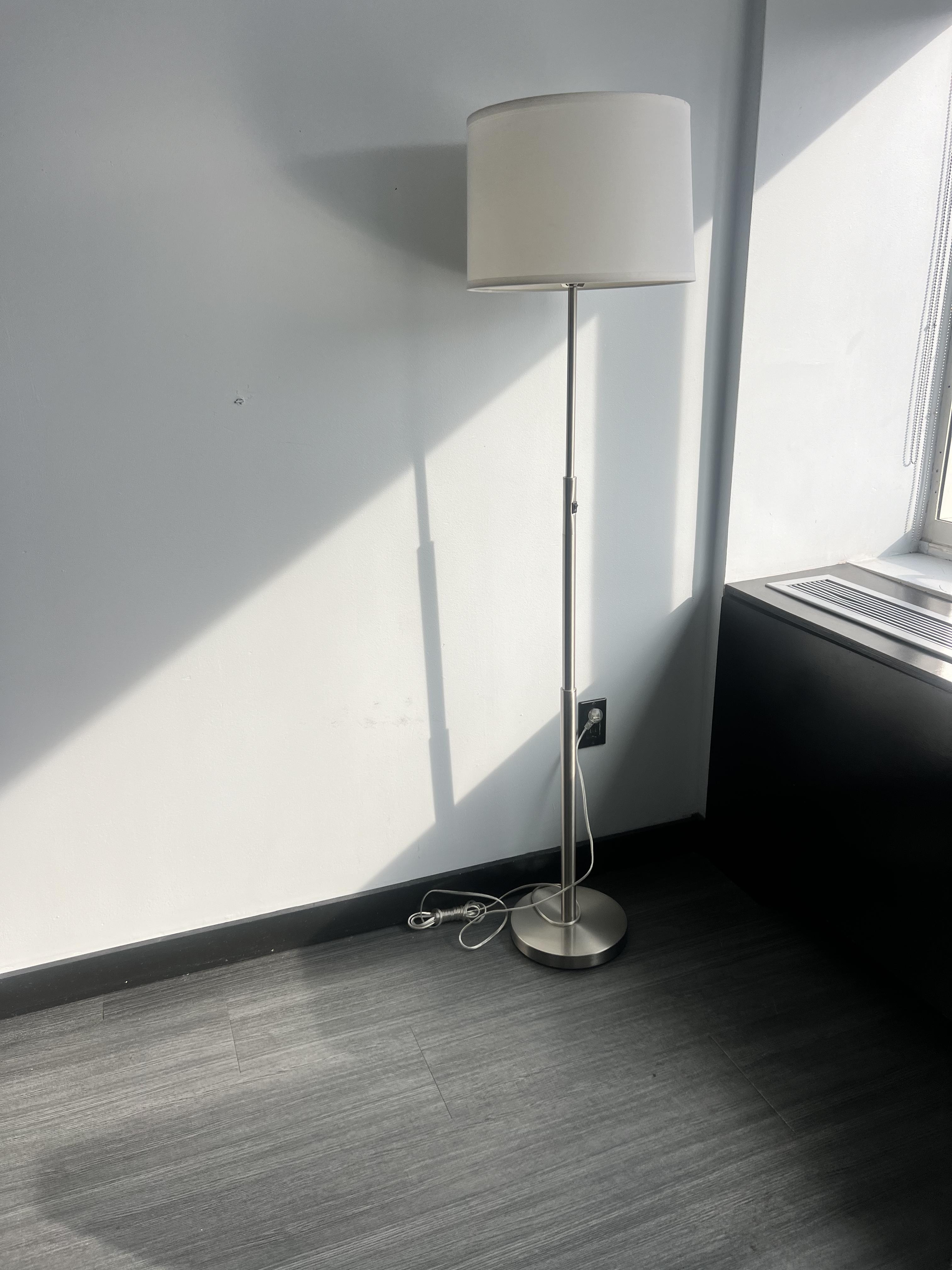 the room had this singular lamp with exposed cords in the corner. Poorly decorated room. 