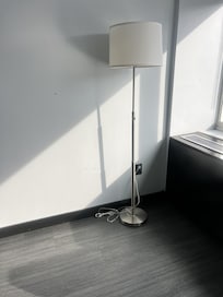 the room had this singular lamp with exposed cords in the corner. Poorly decorated room.