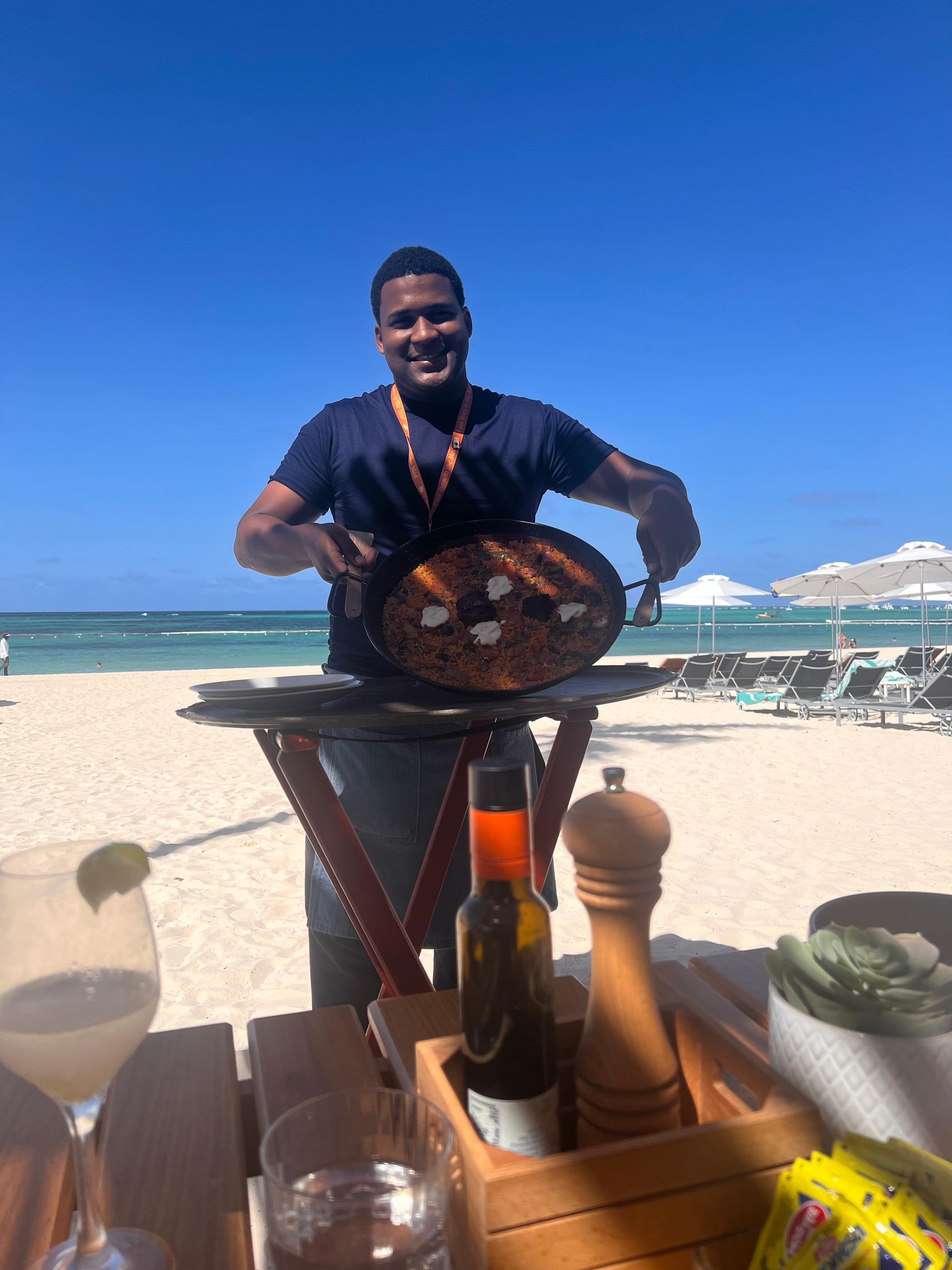 Esmylee serving us the Mountain Rice at the beach club. Favorite dish and favorite guy!