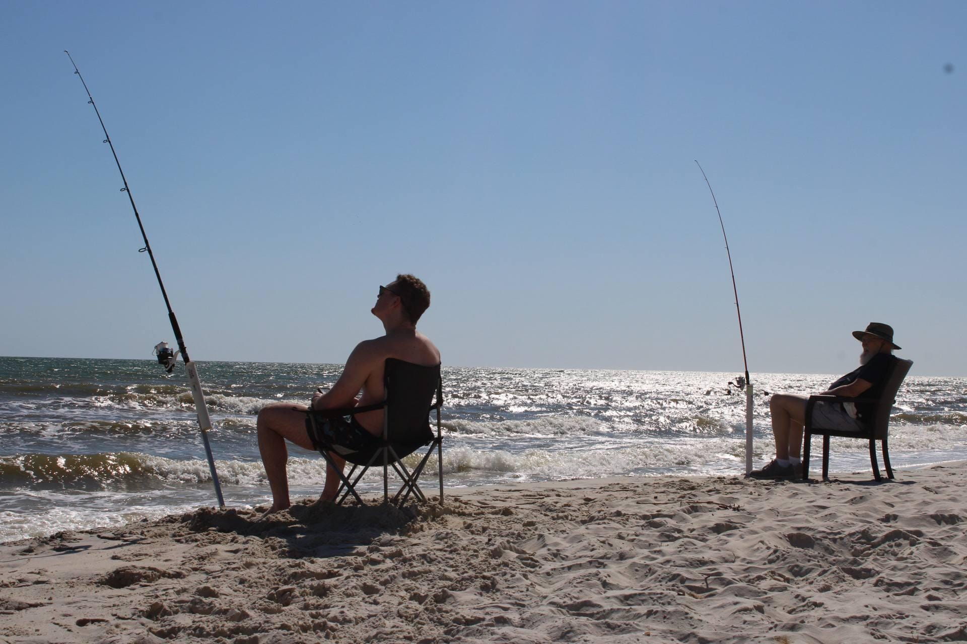 Grandfather and grandson fishing.