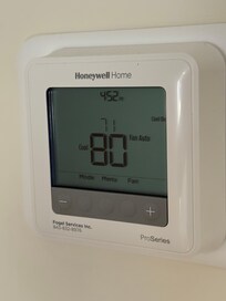 Thermostat set to 71 with inside temp at 80.