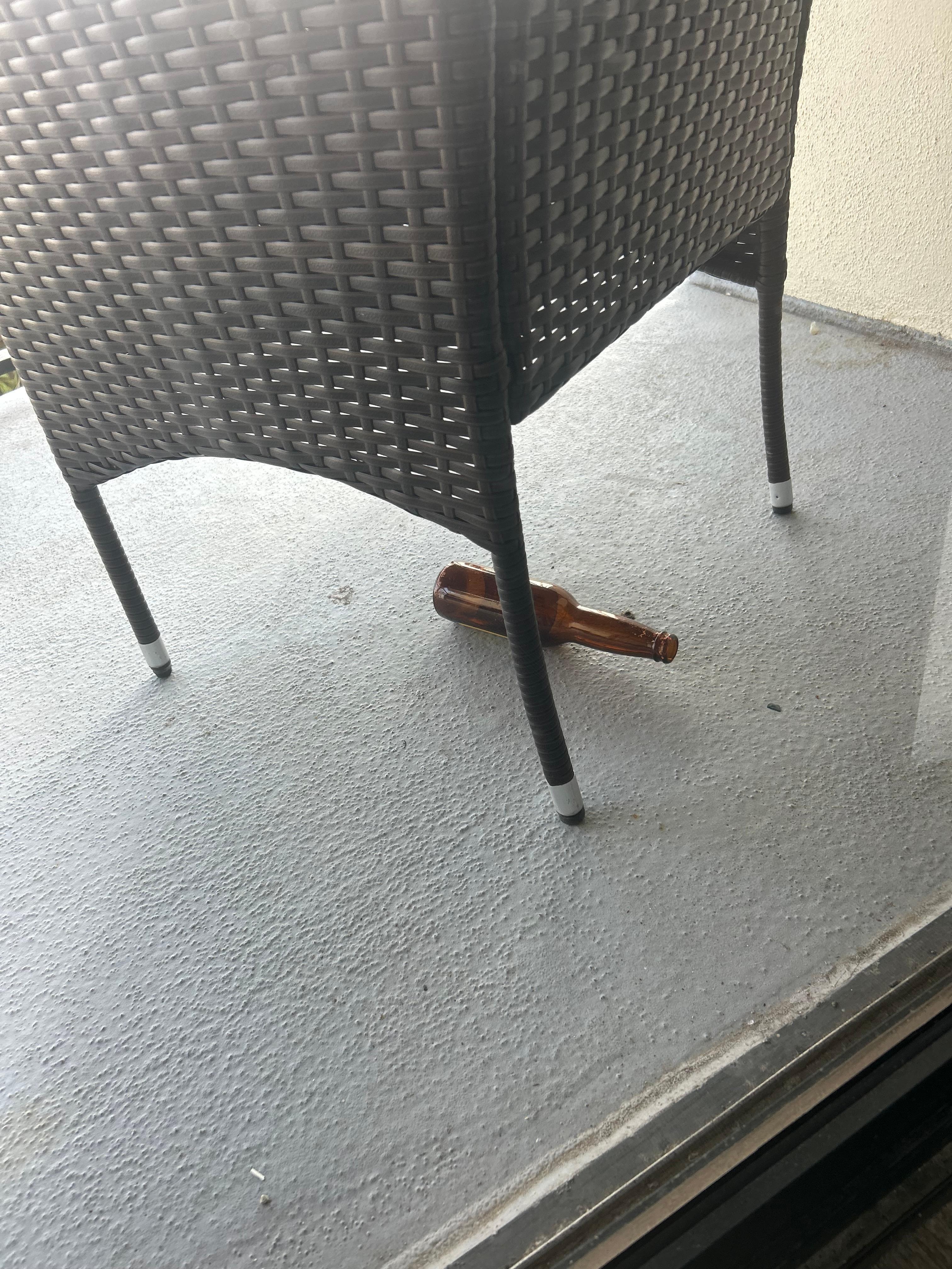 Empty Beer bottle on patio 