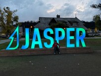 Town sign lights up at night
