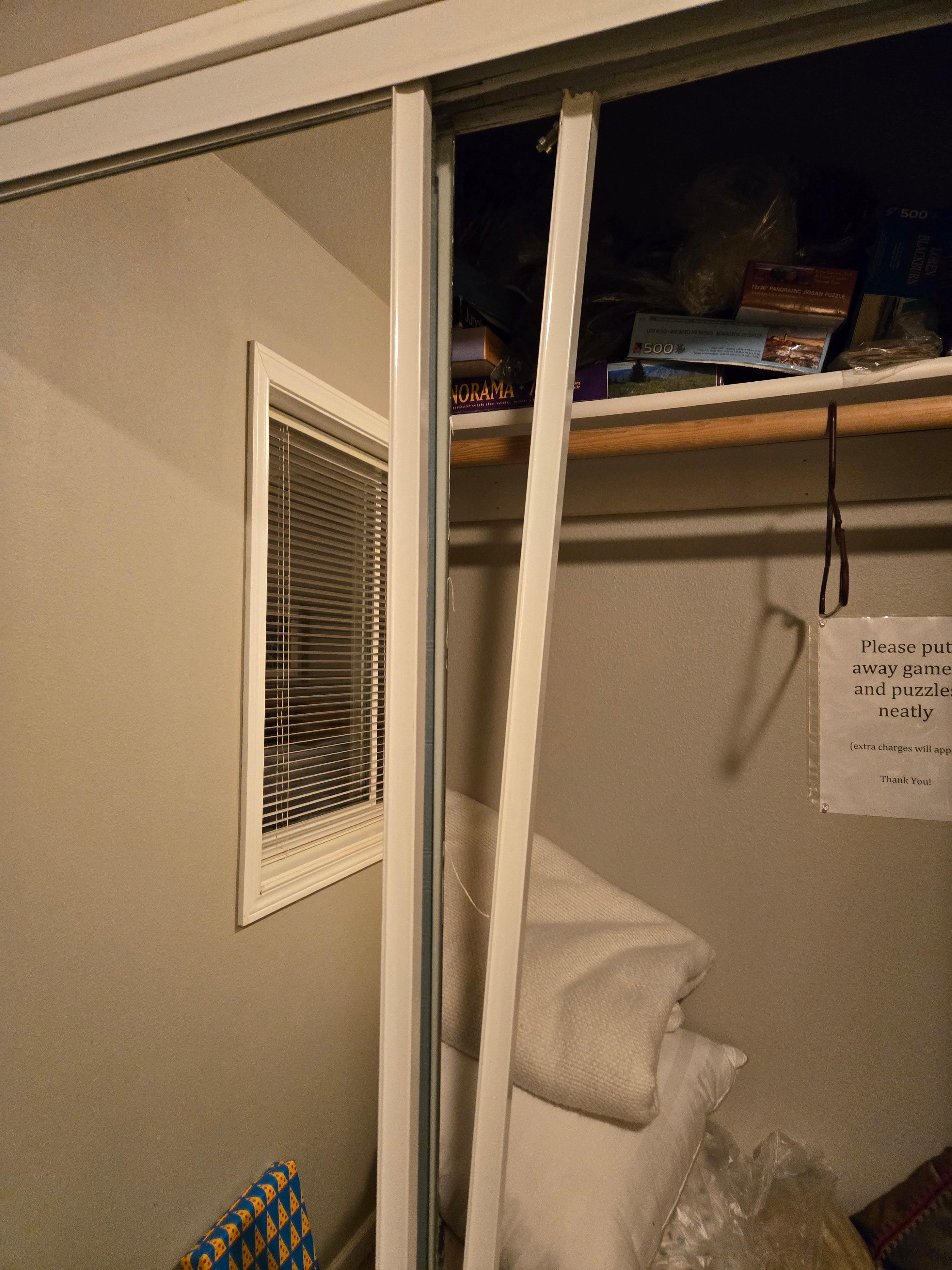 How I found the closet. That loose trim covers a sharp glass edge.