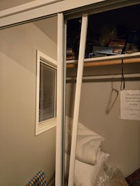 How I found the closet. That loose trim covers a sharp glass edge.