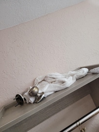 Tools, dirty rags and door knob parts.