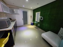 Unit "A" living room / kitchen area. (The "O" ring light rig is provided in the room.)