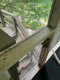 Dirt, Dead Bugs, Cobwebs on Outlet of Screen Porch