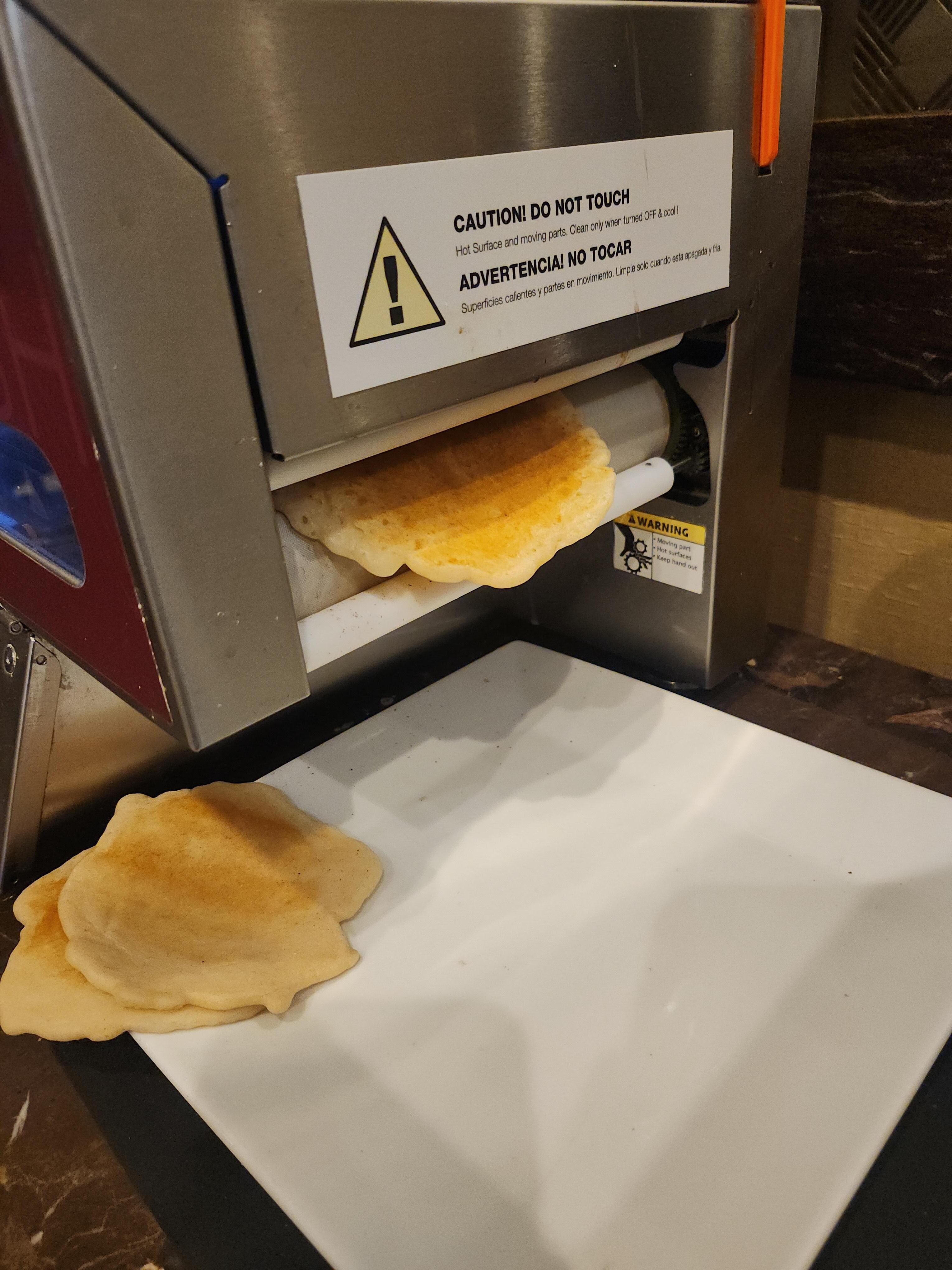 Pancake maker at continental breakfast 
