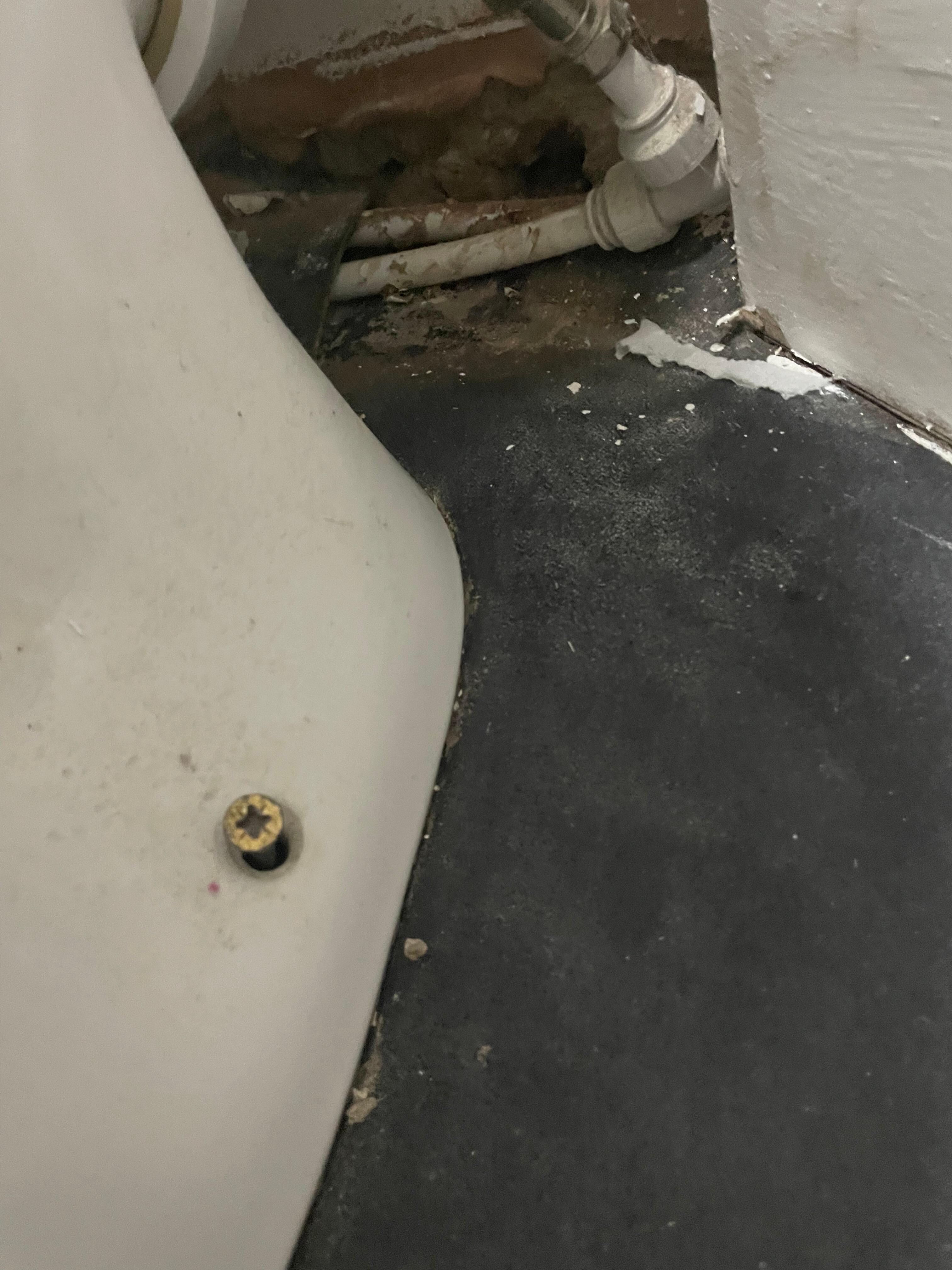 The only fixing holding the toilet in place and it was loose and very dirty behind the toilet 