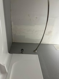 Patched ceilings and rusty/dirty showerhead