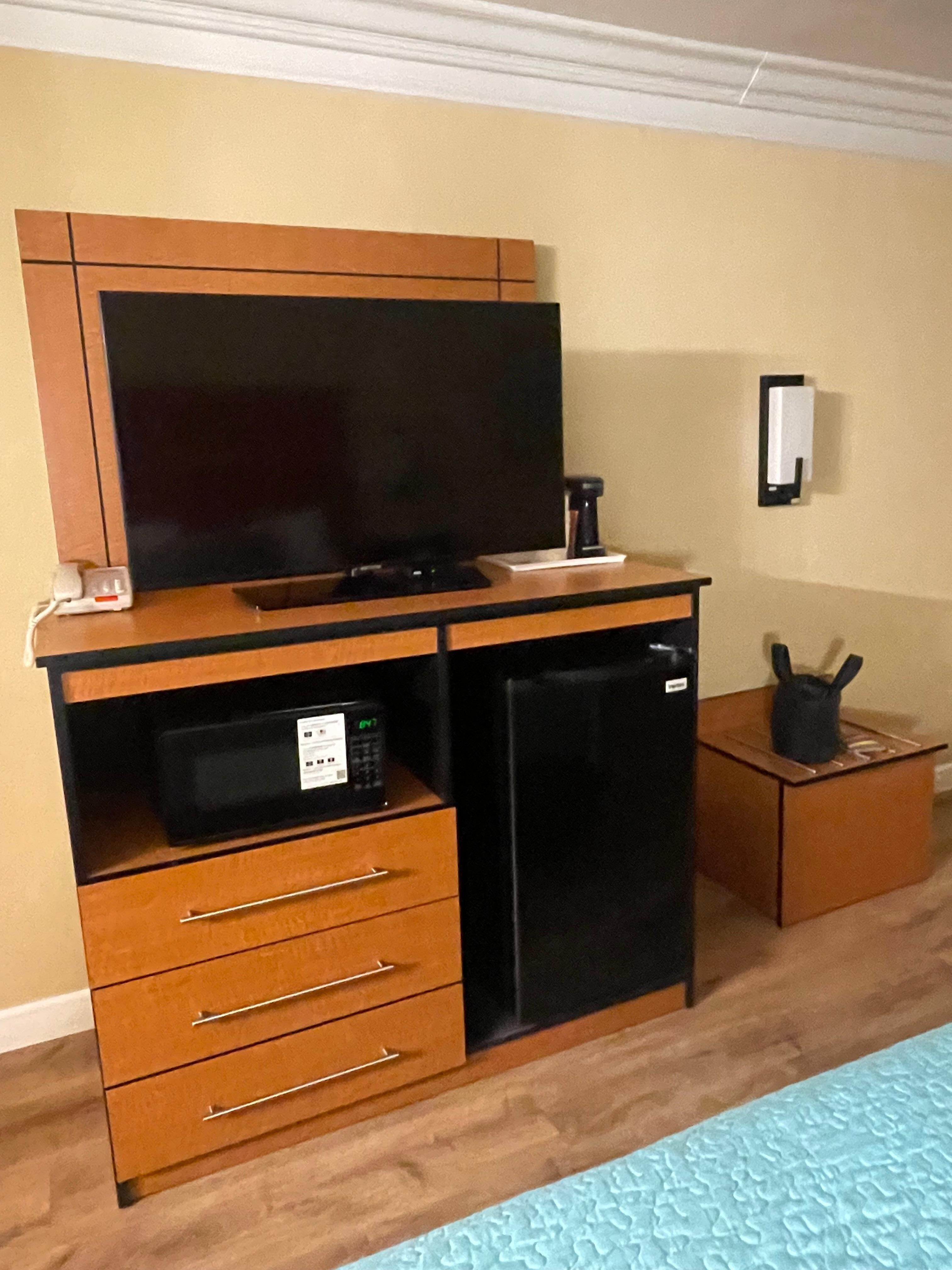 Very nice entertainment center with coffee maker, refrigerator and microwave. 