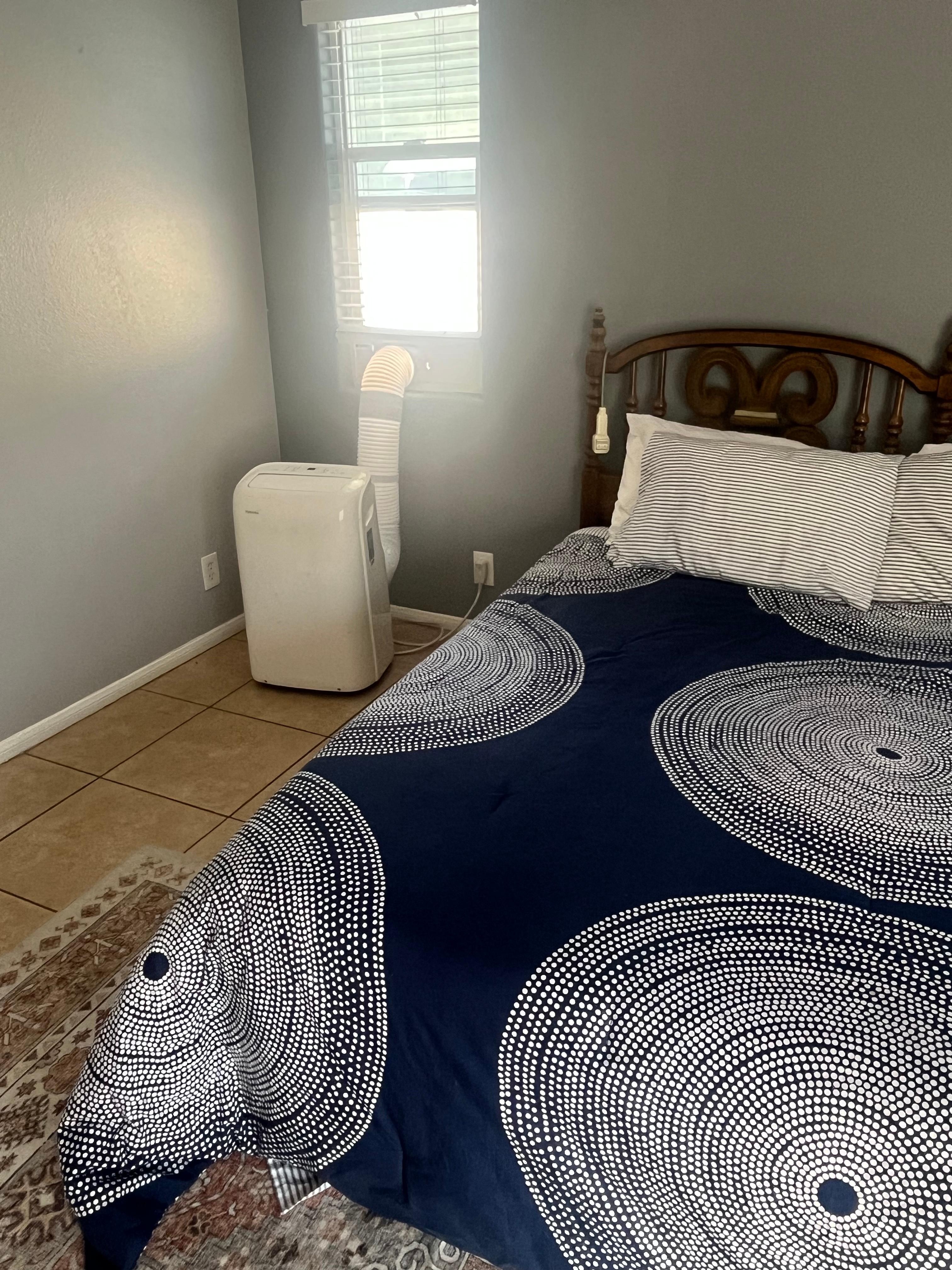 Noisy portable AC next to head of the bed