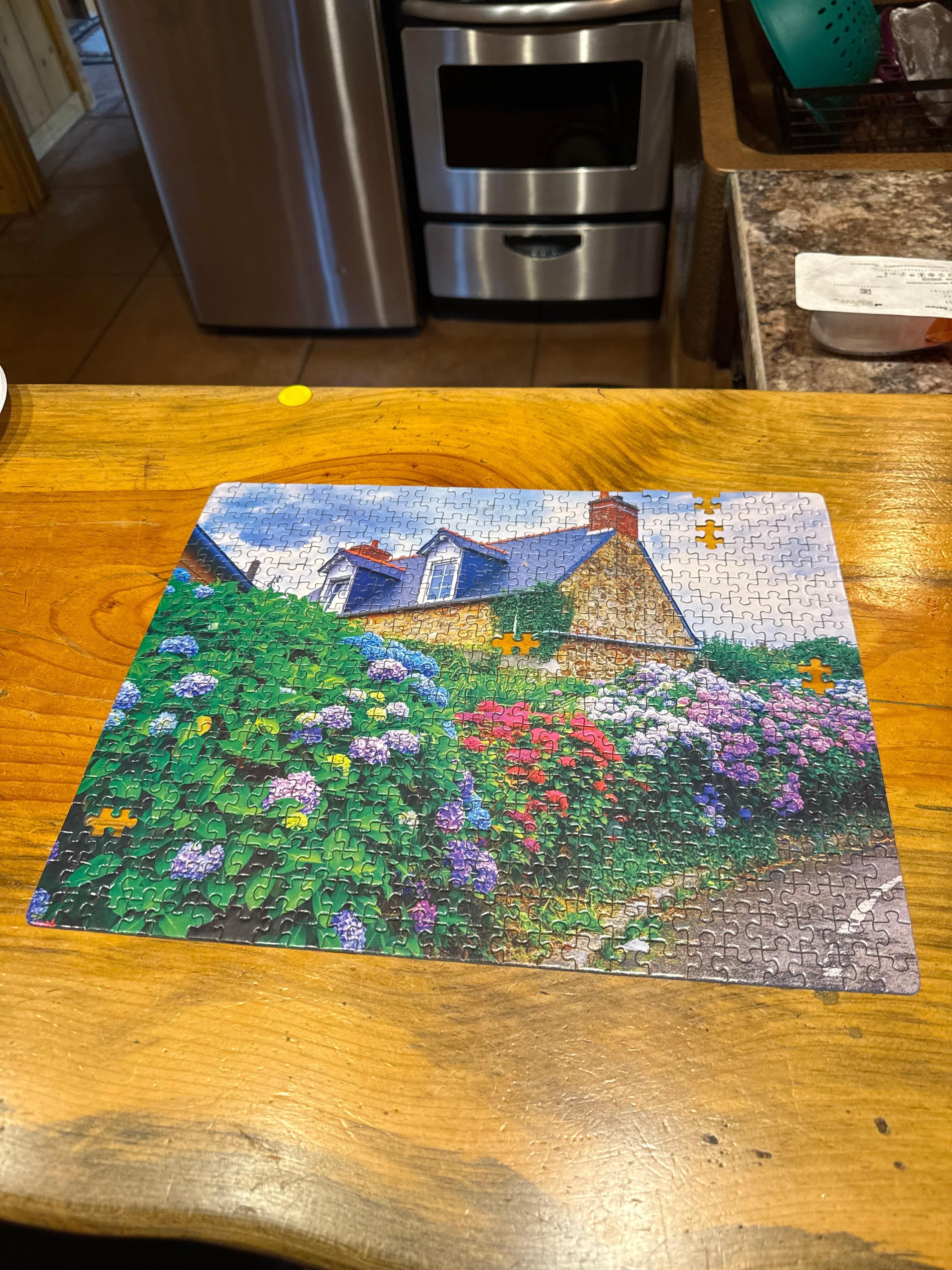 I started the puzzle on the outdoor bar while the dogs ran around the yard in back!! and then i finished it inside