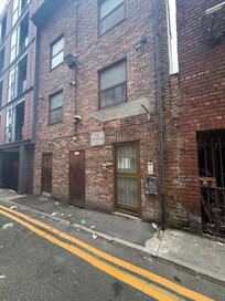 The entrance is an alleyway that is filthy, and lots of antisocial behaviour