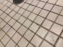 This is the shower floor we had to find slippers to wear in the bath