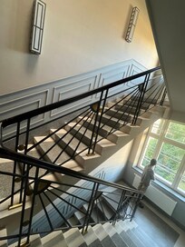 Has elevator and grand stairs