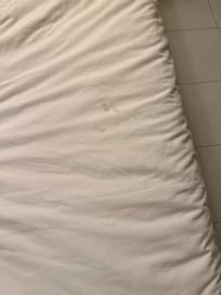 Stains on bed sheets.