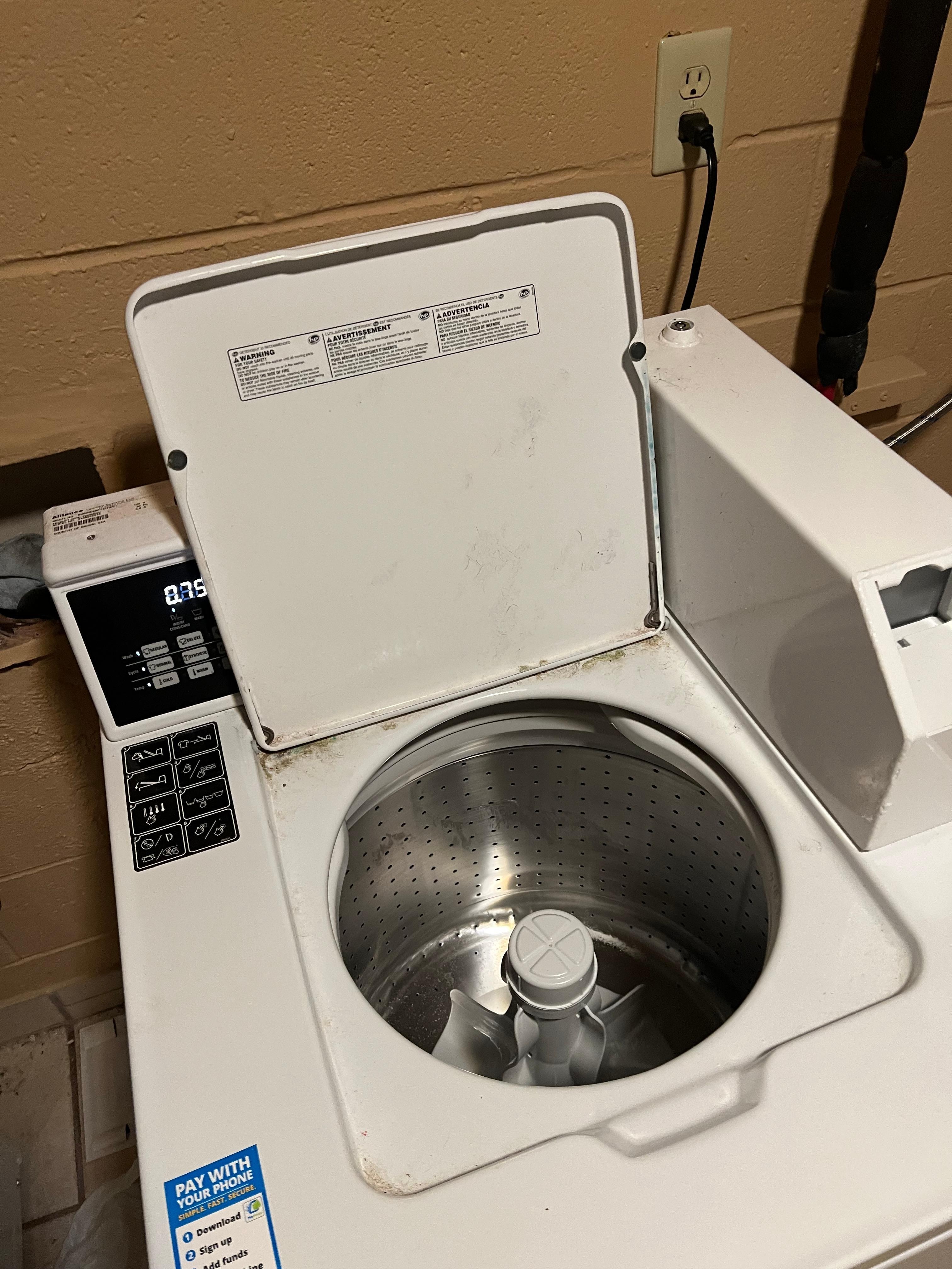 My empty washer after having to reach in and pull out piss clothes covered in powdered laundry detergent.