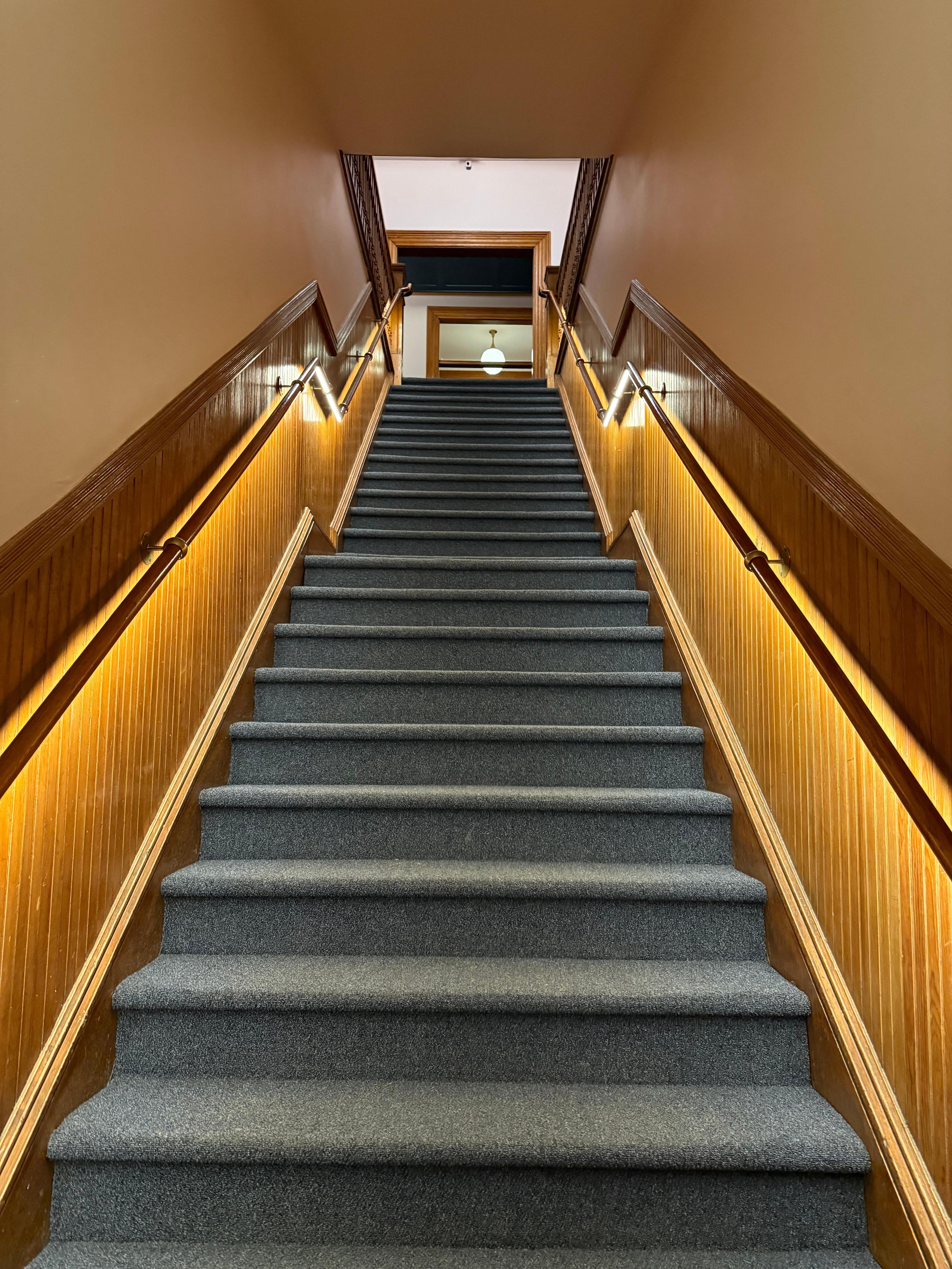 Staircase to the rooms which are located on the second floor. 