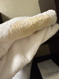 Towels that were in the clean pile on the shelves