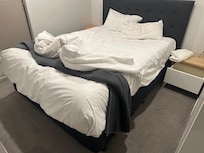 Used bed spread upon entry