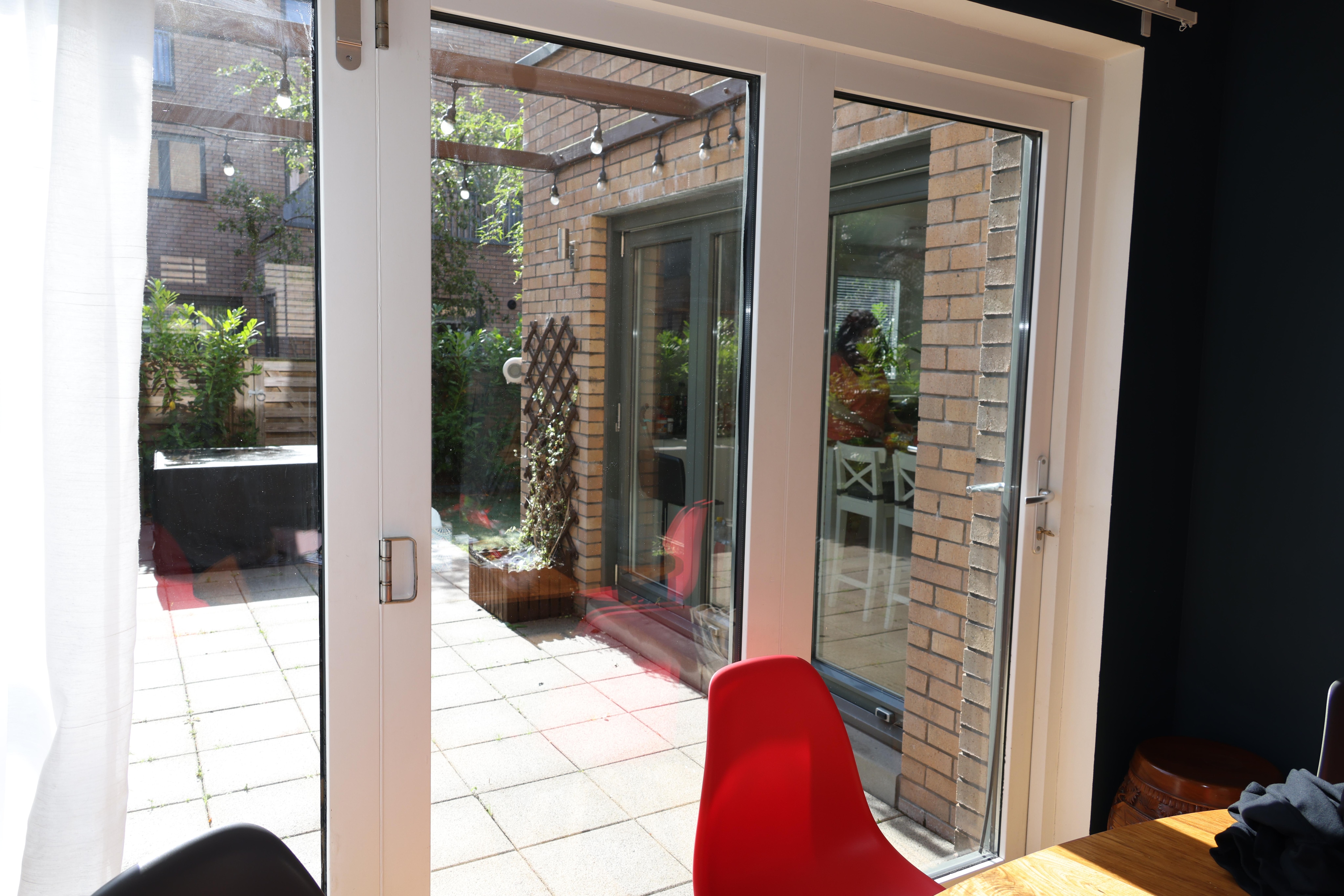 a view from the Dining to the backyard and Kitchen