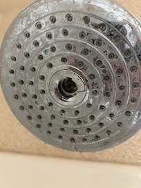 Broken shower head and lowest water pressure from shower we have seen before