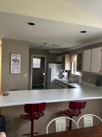 Kitchen with laundry room beyond.