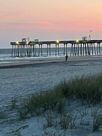 Sunset over a pier off the Wildwood boardwalk Pier