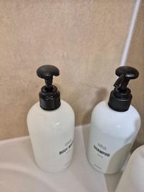 Black hairs on the soap dispenser and broken pump.