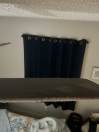 Thick layer of dust on fan in bedroom