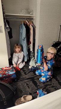 Playing airport in the closet. Having so much fun!! Just before bed. After baths.