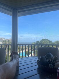 Enjoying a quiet bit listening to the waves from the screened in deck.