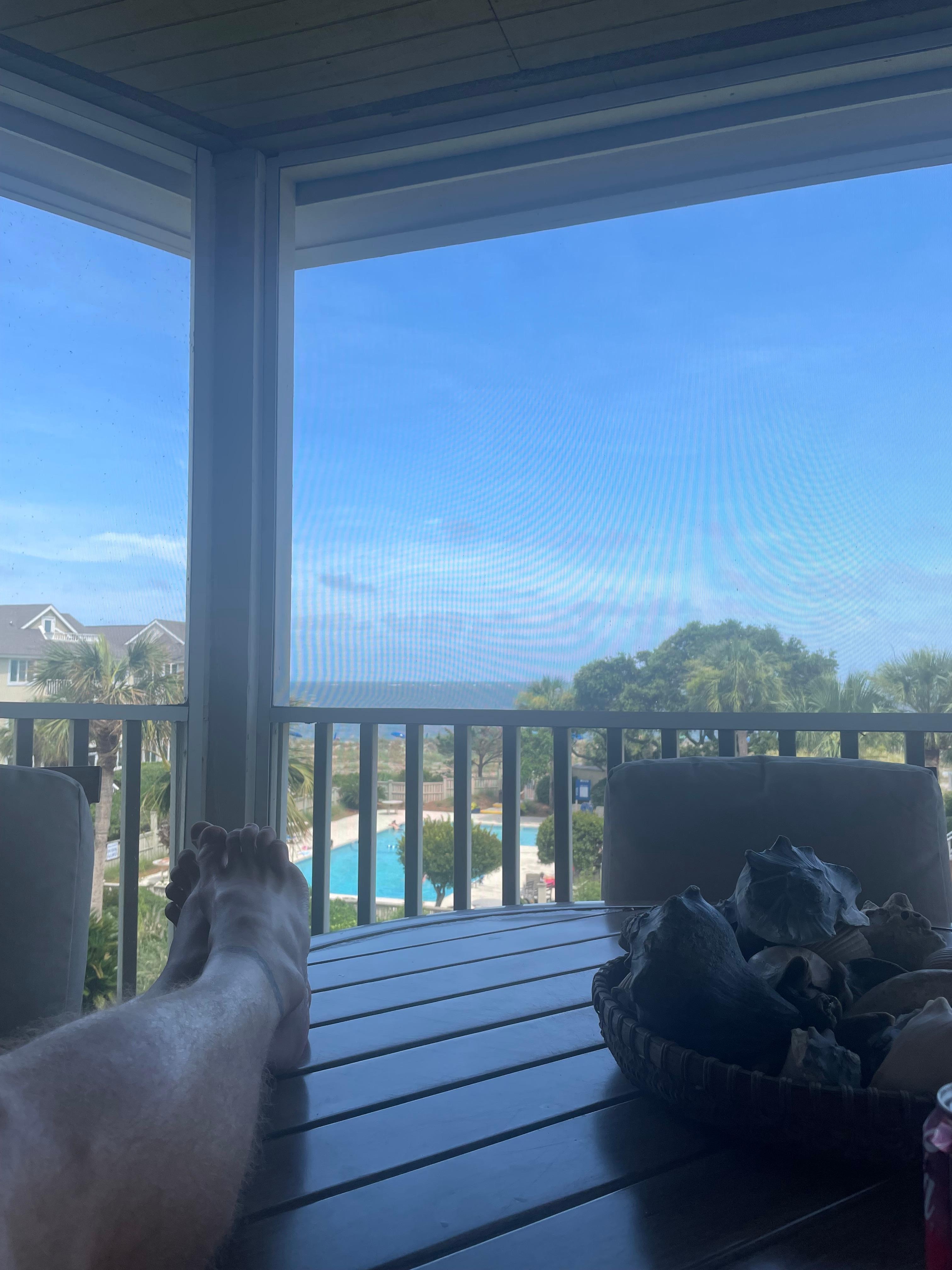 Enjoying a quiet bit listening to the waves from the screened in deck.