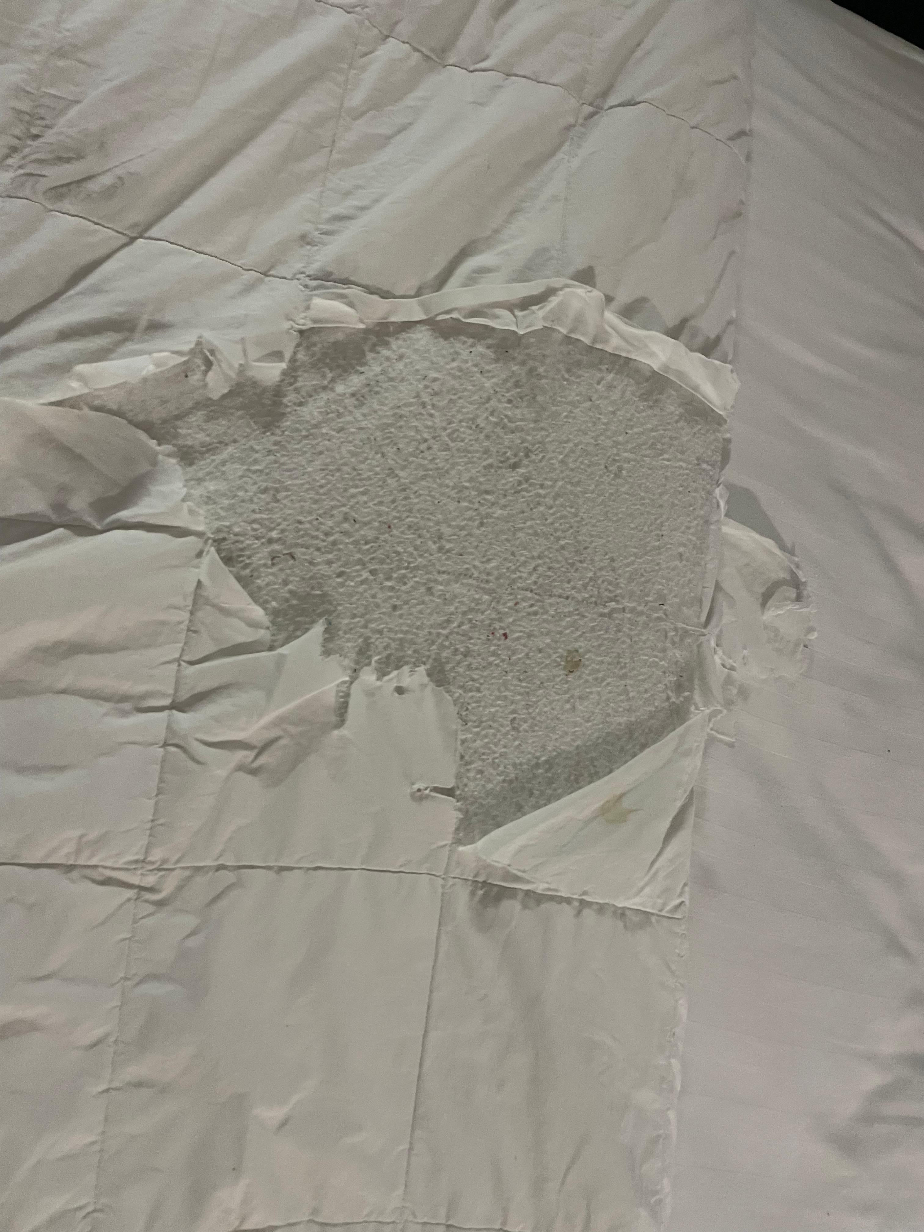 Ripped top and covered up by an additional sheet on top