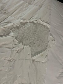 Ripped top and covered up by an additional sheet on top