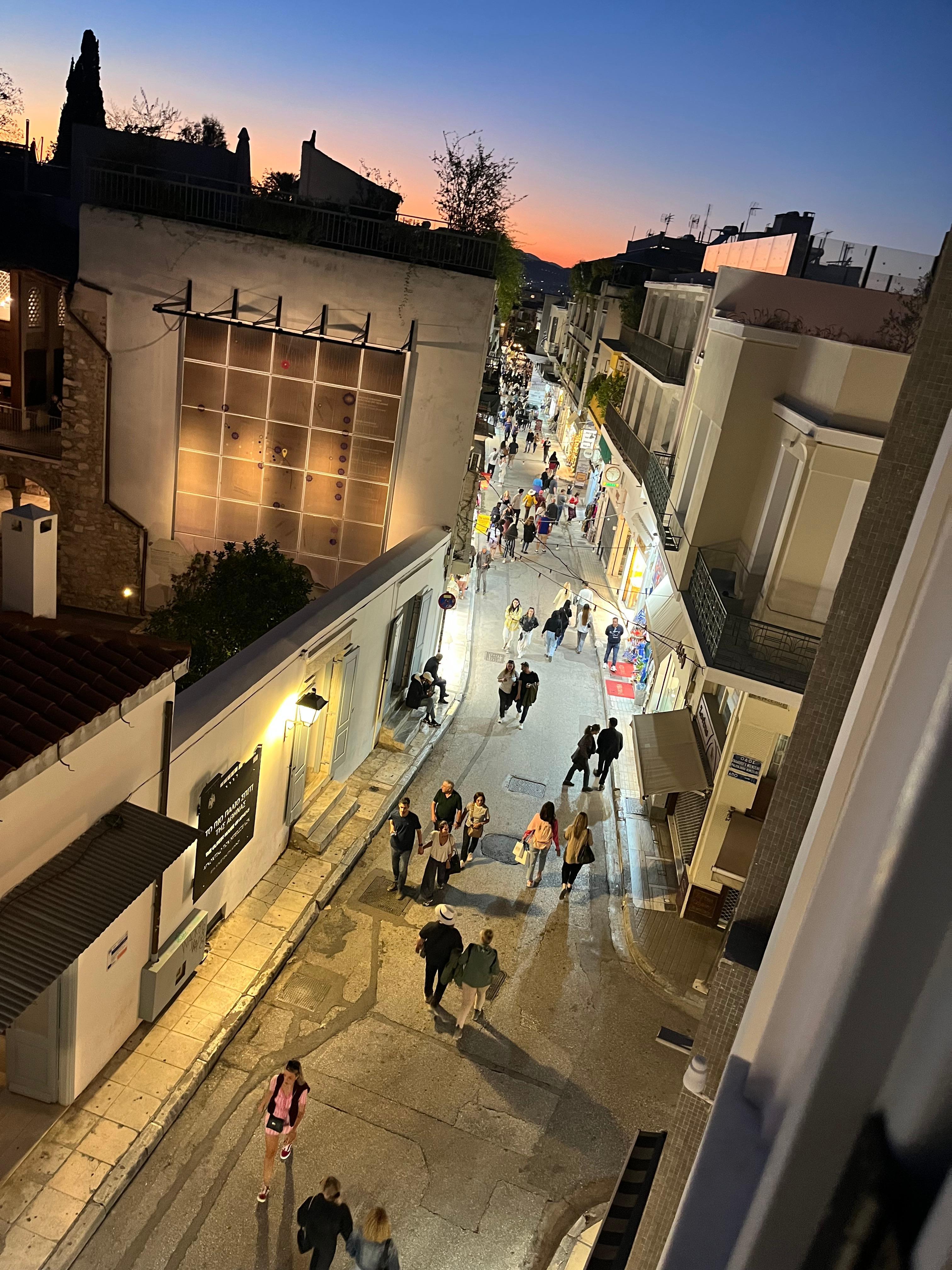 The view of the street outside the window at sunset