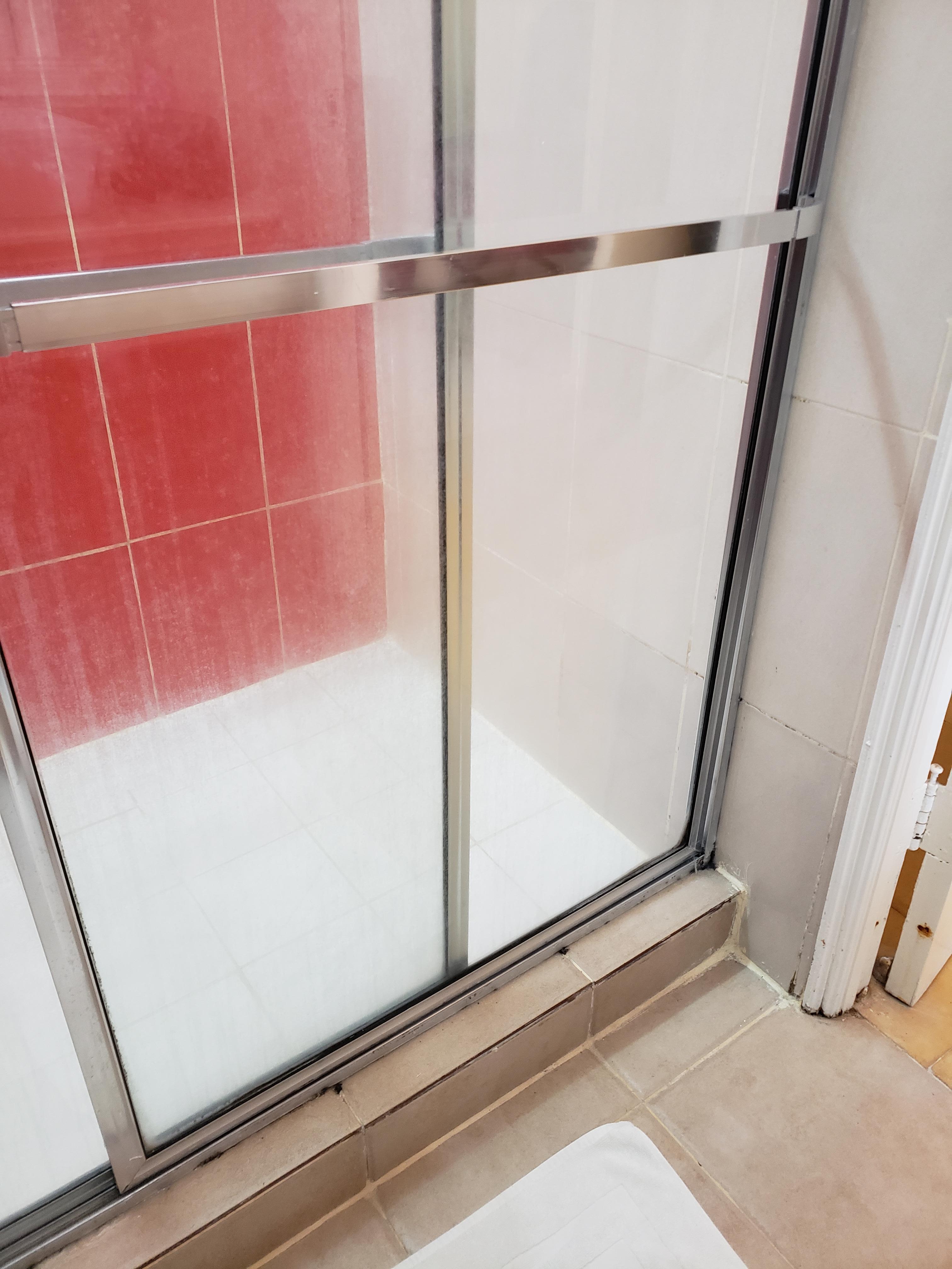 Mold all around the shower area. Doors so dirty.