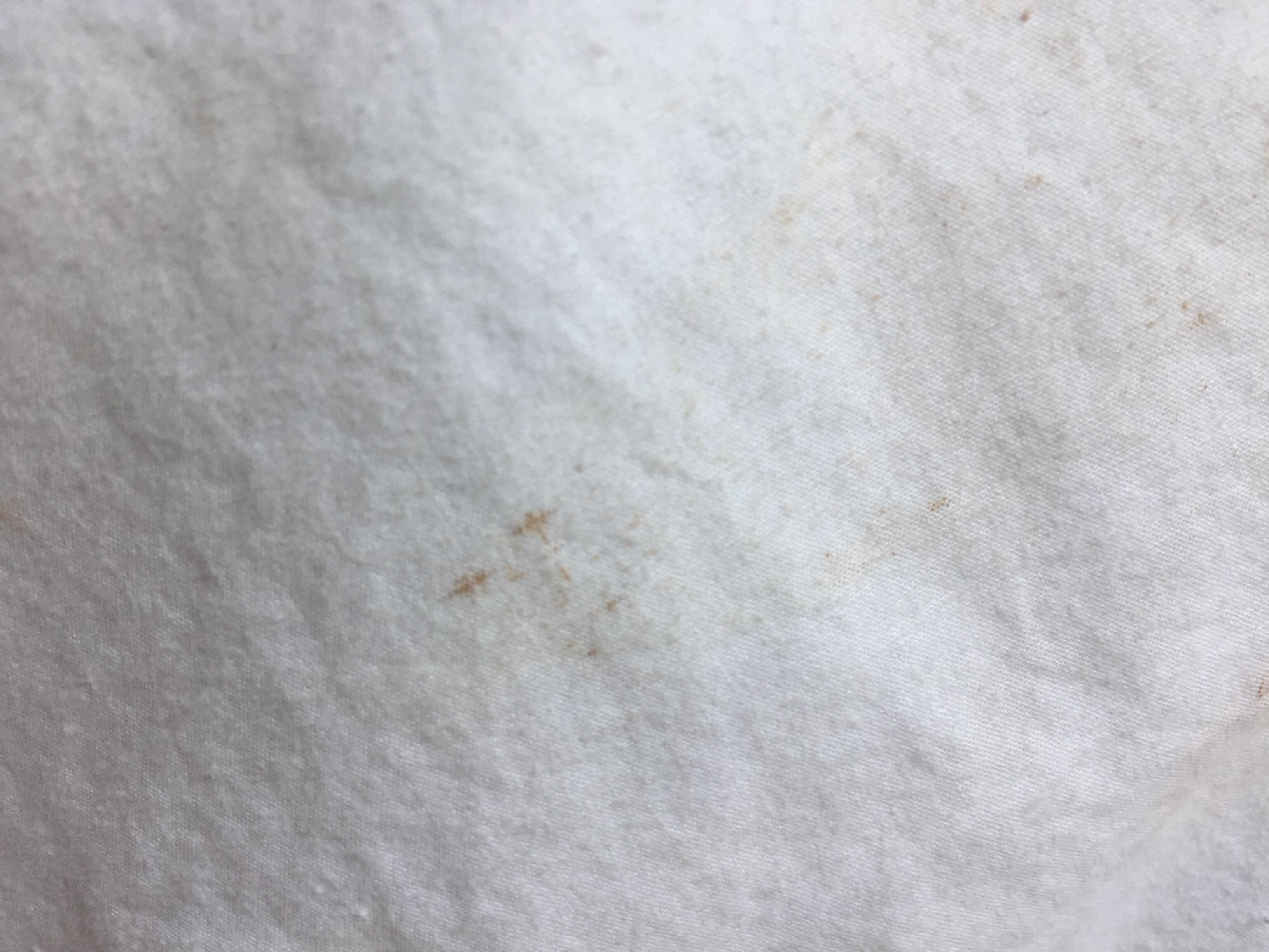 Dark stains on sheets