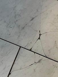 Broken tile in bathroom, actually covered 20sq ft.