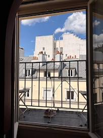 Tiny sitting terrace out of the window.