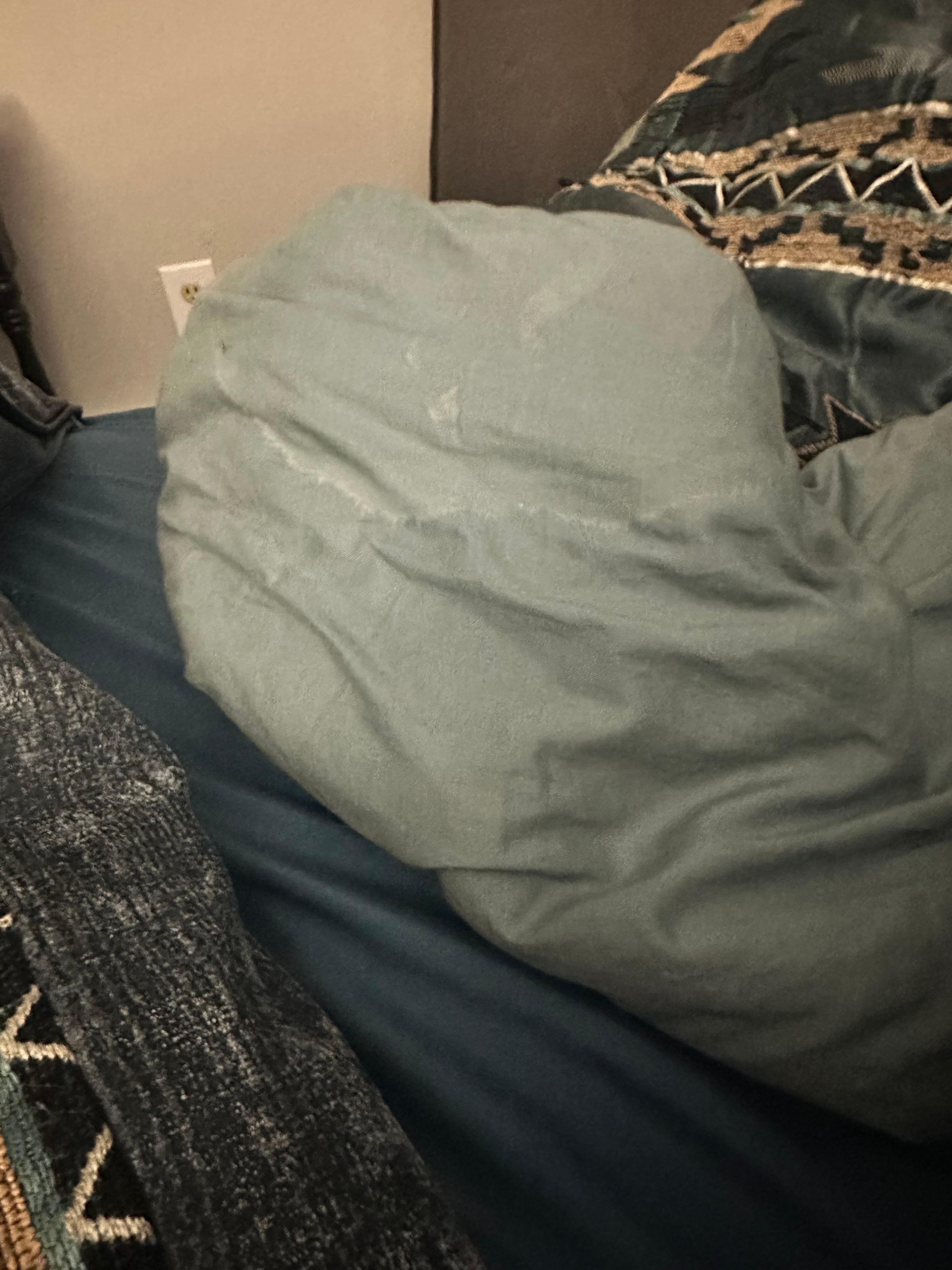 Linen on the bedding in the downstairs room with the balcony 